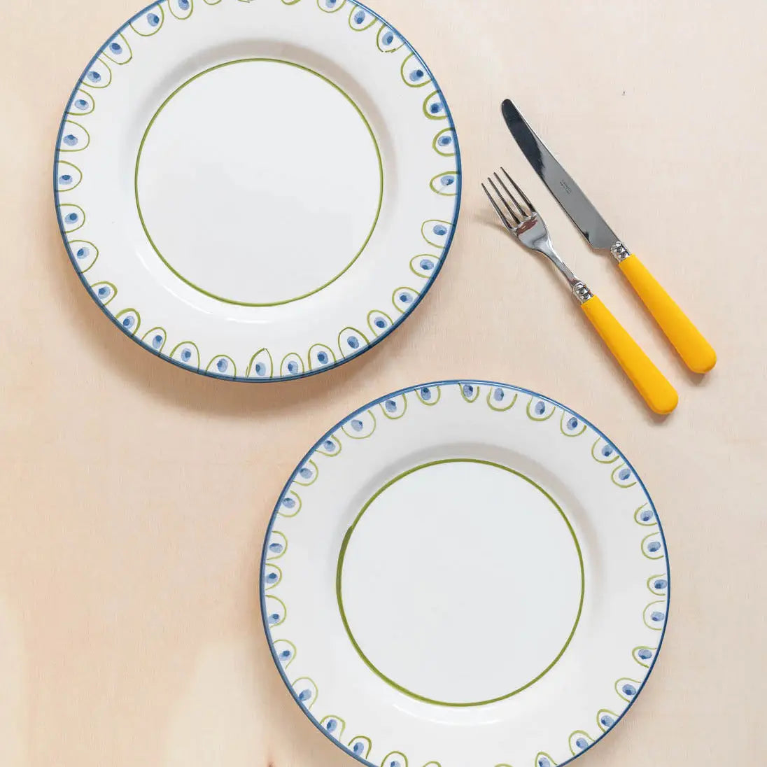 Coconut dinner plate shown with matching Coqueiro dessert plate, hand-painted ceramic tableware from Portugal