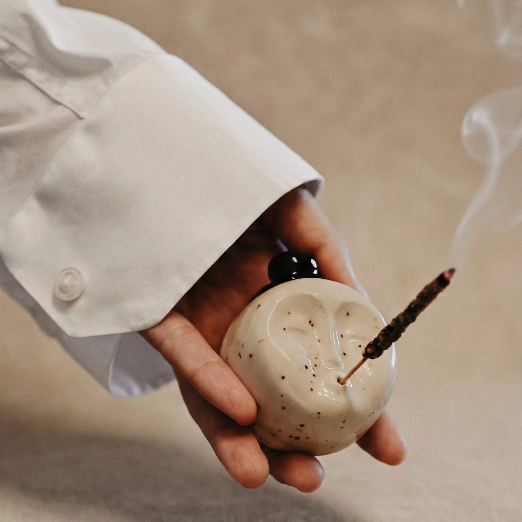 The Dohyo stoneware incense holder with rounded sumo-inspired form and speckled glaze, hand-built by ÜM Studio in Southern Spain, from WILLAGE