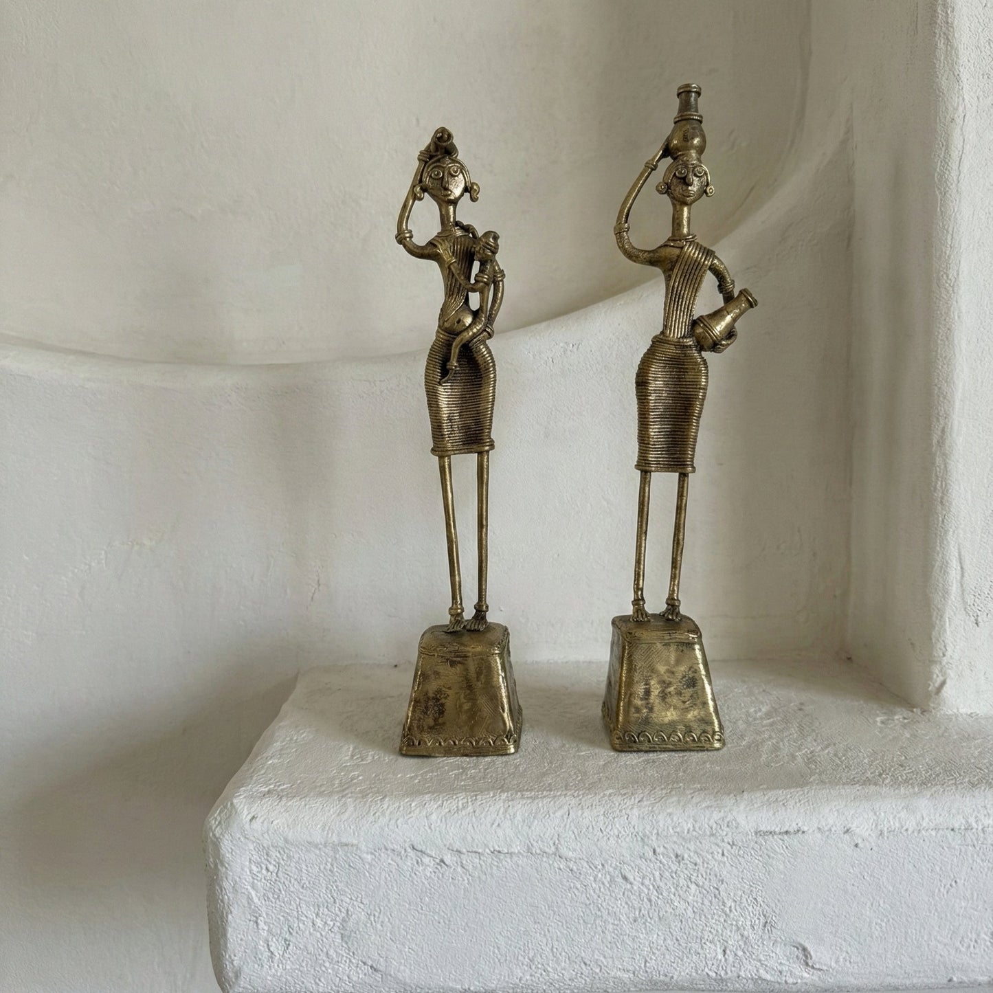 Close-up of The Nurturing Mother showing Dhokra lost-wax casting surface detail and organic texture