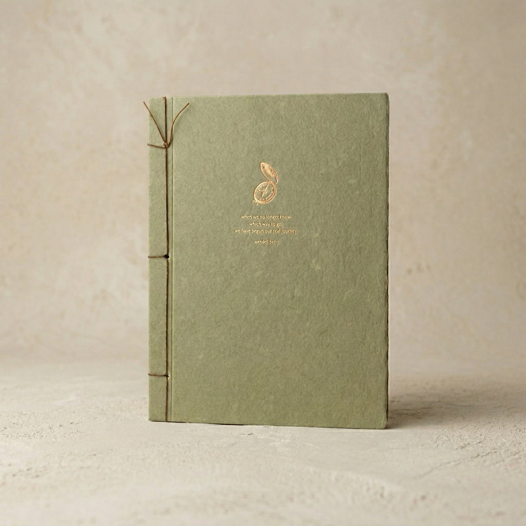 Wendell Berry Inspiration Journal in olive recycled cotton with copper foil compass and Japanese stab binding