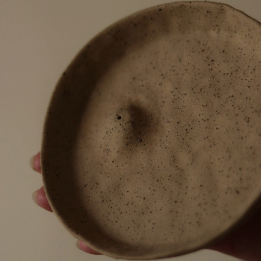 Earth-toned incense holder crafted from natural gathered materials