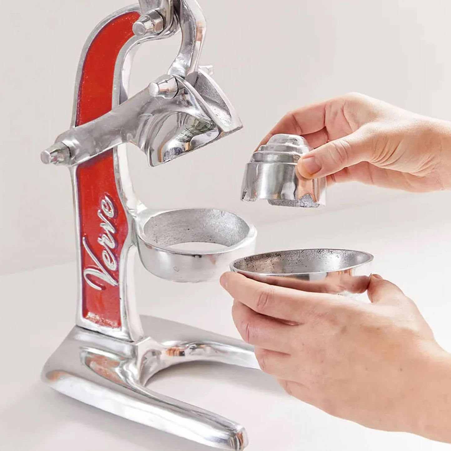 Vintage-style countertop citrus press with red accent handle