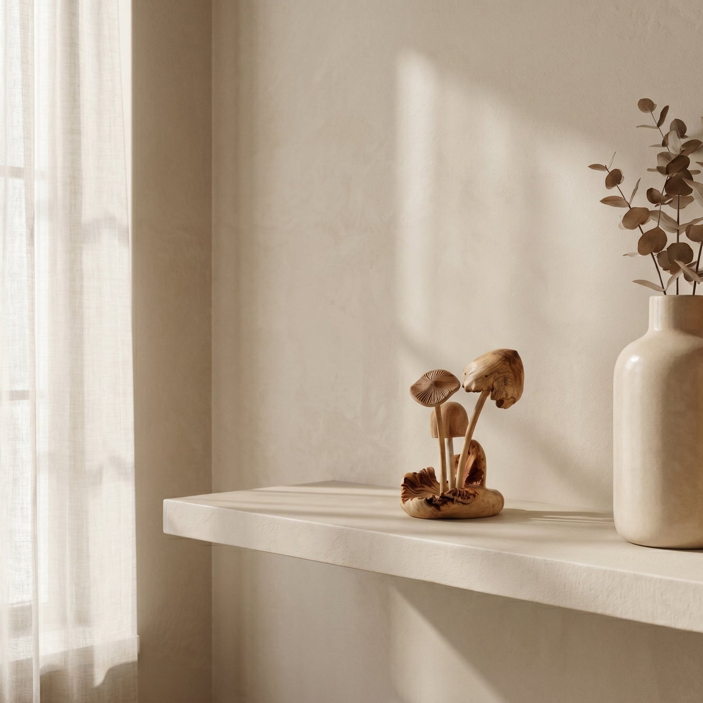 Jempinis wood mushroom sculpture styled on a shelf with dried botanicals and books, forest-inspired home decor from WILLAGE