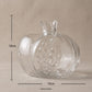 Large and small red glass pomegranate vases on a wooden tray


