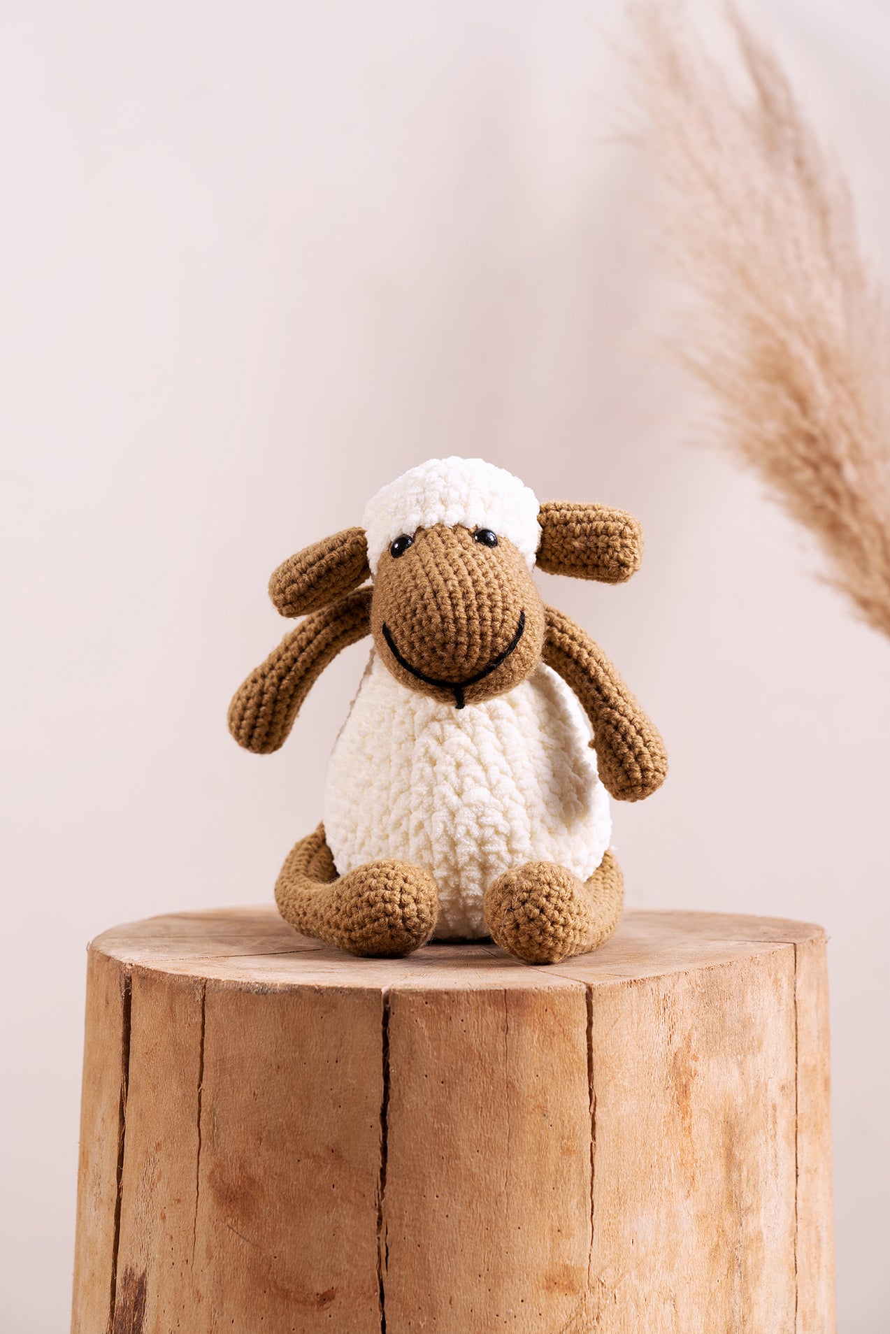 Soft amigurumi sheep toy crafted in India using traditional techniques