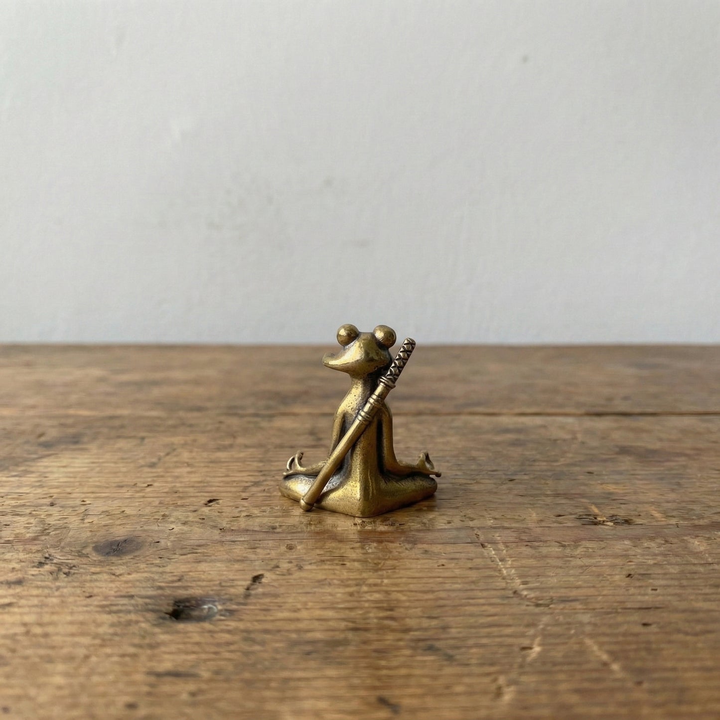 The Balanced Warrior miniature brass frog figurine seated cross-legged holding a staff, solid brass with aged patina, from WILLAGE Tiny Objects collection