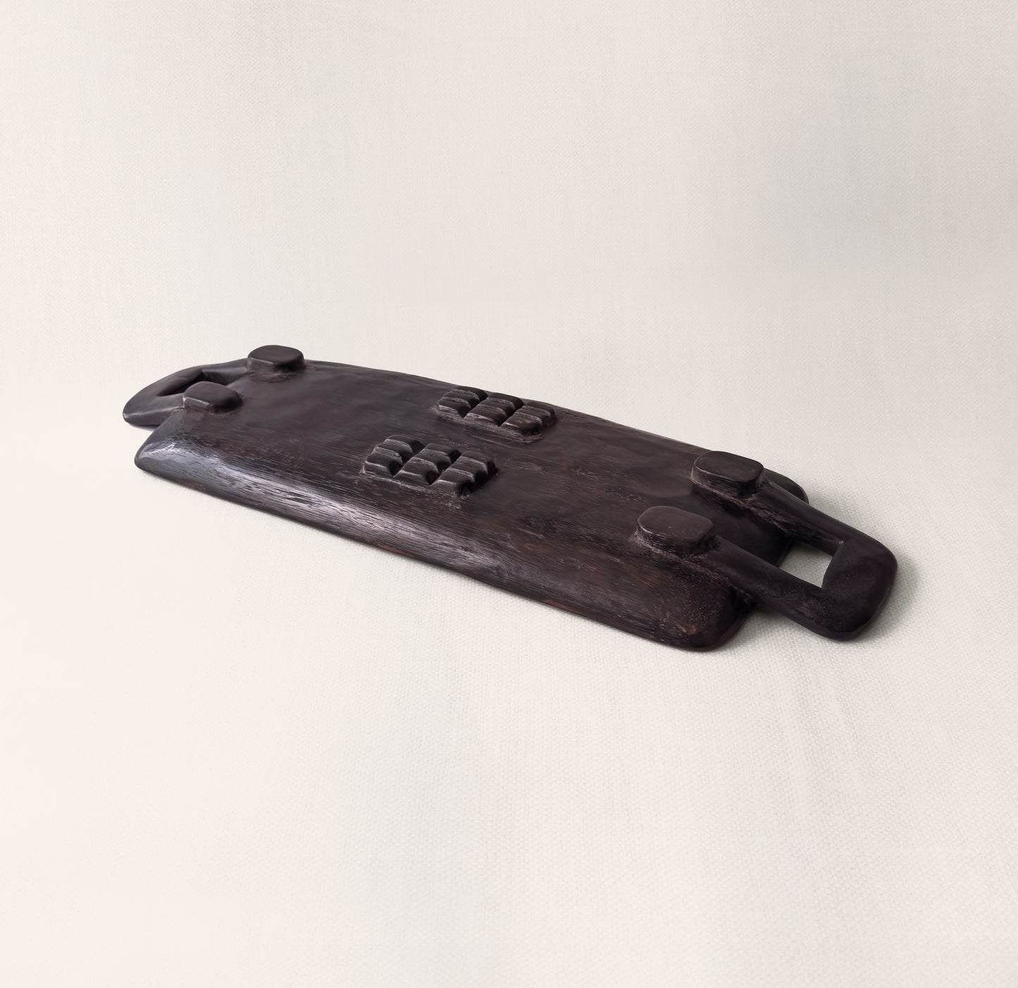 Top-down view of Bamenda hand-carved hardwood serving tray showing wood grain and rectangular form, from WILLAGE