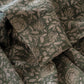 Rio Green block-printed linen napkins on gingham placemats with matching botanical tablecloth, full place setting with ceramic plates and vase
