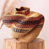 Bolgawoven sculpture basket in brown and black geometric pattern, handwoven from naturally dyed elephant grass by Nanasei Agyemang in Ghana, from WILLAGE