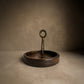 Close-up of Dhokra brass handle on The Brass Hold serving board showing lost-wax casting texture