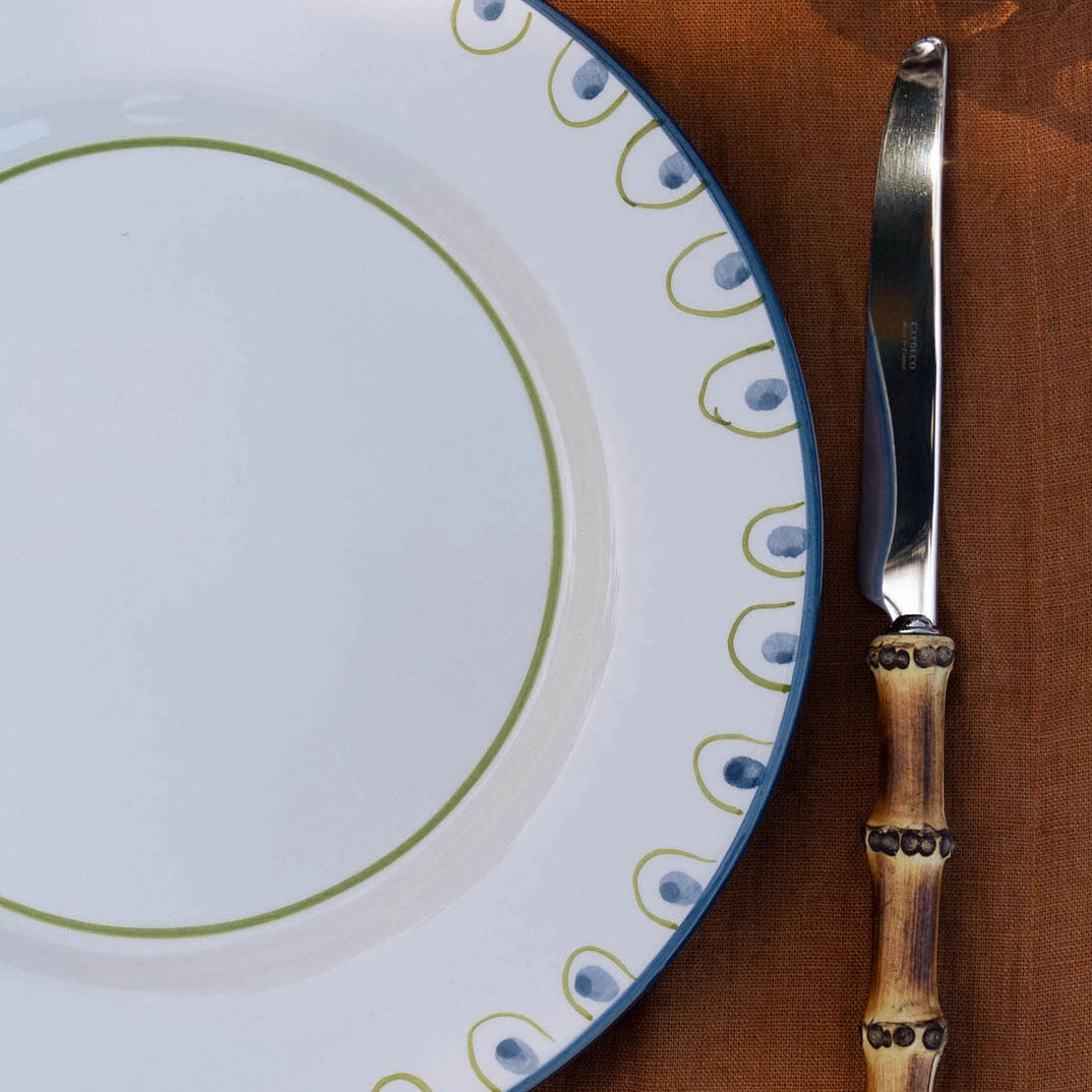 Coconut dinner plate styled as place setting with cutlery, hand-painted Portuguese ceramic tableware from WILLAGE
