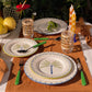 Ceramic dinner plate with hand-painted coconut and dot pattern rim, handcrafted in Portugal by Raquel Souza