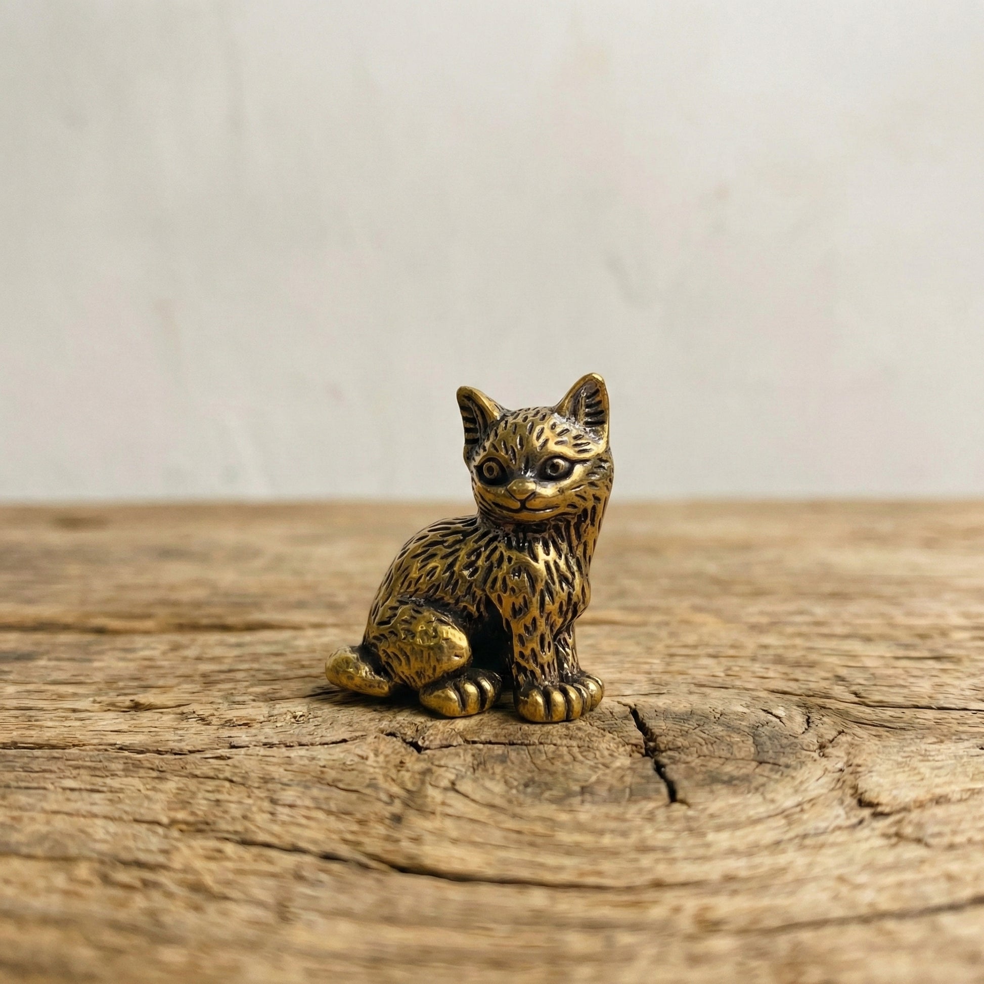 Curious One miniature brass kitten figurine in standing pose with ears lifted, solid brass with aged patina, from WILLAGE Tiny Objects collection