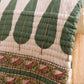 Hand block-printed cypress leaf motif on cotton voile quilt, showing artisan stitching, from WILLAGE