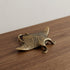 The Drifter miniature solid brass manta ray figurine with finely textured wings and aged antique patina