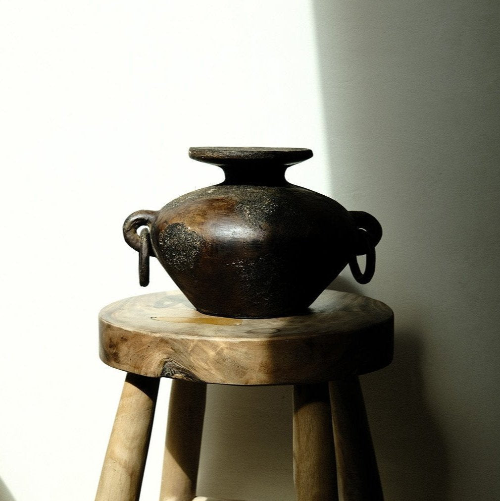Febi terracotta vessel with sculptural handles styled on wooden stool, handcrafted in Indonesia, from WILLAGE