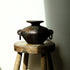 Febi terracotta vessel with sculptural handles styled on wooden stool, handcrafted in Indonesia, from WILLAGE