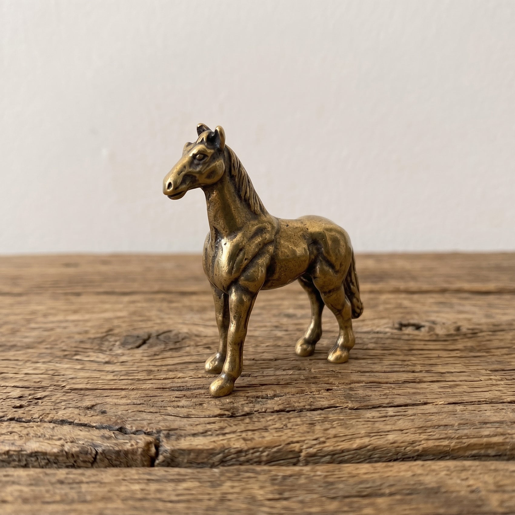 The Free Rein miniature solid brass horse figurine standing alert with detailed mane, warm antique patina