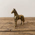 The Free Rein miniature solid brass horse figurine standing alert with detailed mane, warm antique patina