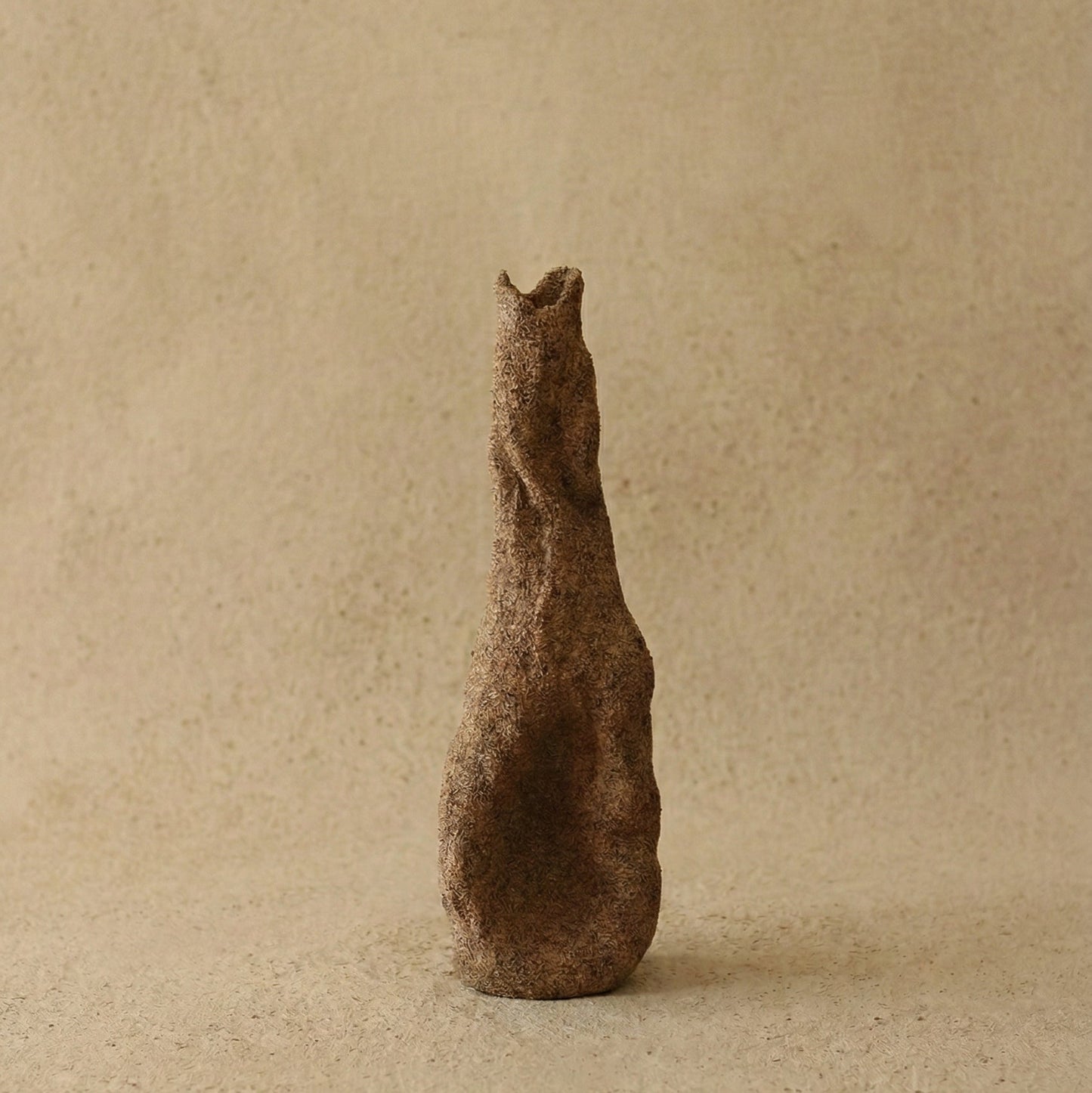 The Gathered Earth Vessel hand-built unglazed clay vase showing raw coarse texture and mineral variations, made by Conrad and Dina in Canada, from WILLAGE