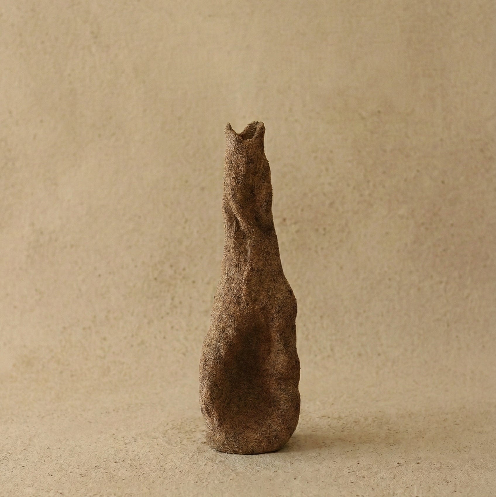 The Gathered Earth Vessel hand-built unglazed clay vase showing raw coarse texture and mineral variations, made by Conrad and Dina in Canada, from WILLAGE