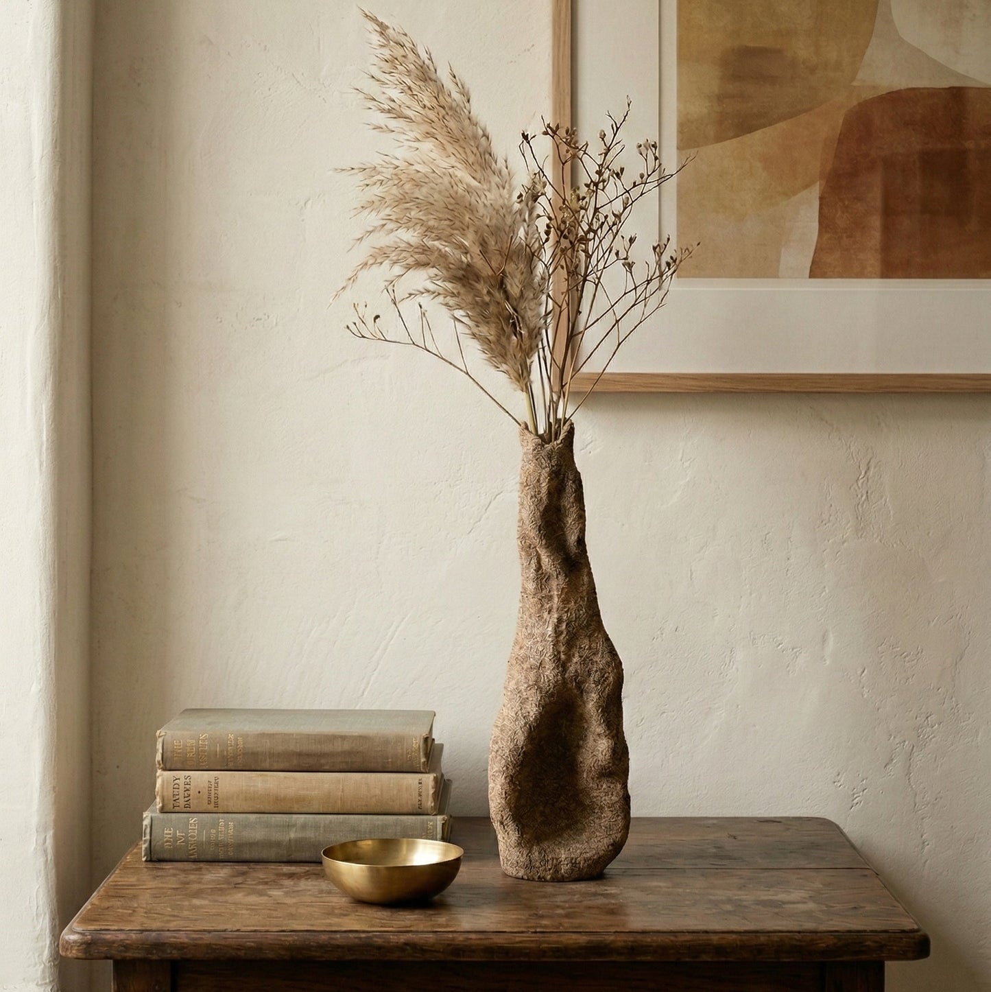 The Gathered Earth Vessel hand-built clay vase shown in room context displaying its 12.5-inch height and raw earth finish