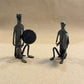 The Gong Players Bastar wrought iron sculpture pair showing two hand-forged figures holding gongs, handcrafted in Chhattisgarh India, from WILLAGE