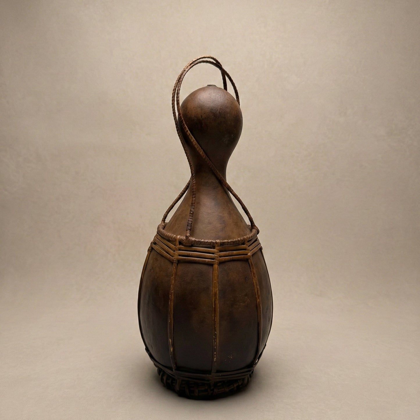 The Grand A·chik Canteen forest gourd vessel with hand-split rattan and cane bindings, from the Garo Hills of Meghalaya India, from WILLAGE