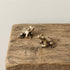 he Harmonic Herald miniature solid brass frog pair on natural wood block showing aged patina detail