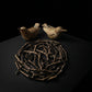 Hummingbird salt and pepper set deconstructed showing two cast pewter bird vessels and woven branch nest tray