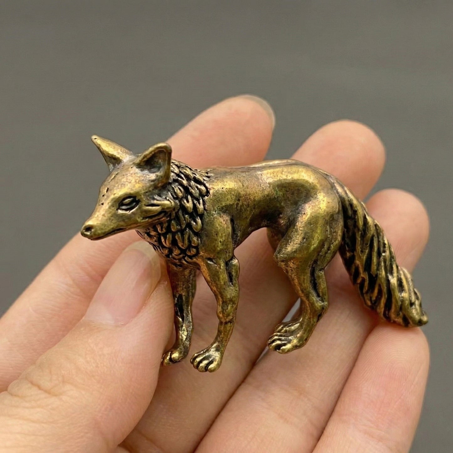 Close-up of The Keen Fox brass figurine showing hand-cast surface texture and alert posture