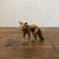 The Keen Fox miniature brass fox figurine in crouched alert pose with head lowered, solid brass with aged patina, from WILLAGE Tiny Objects collection