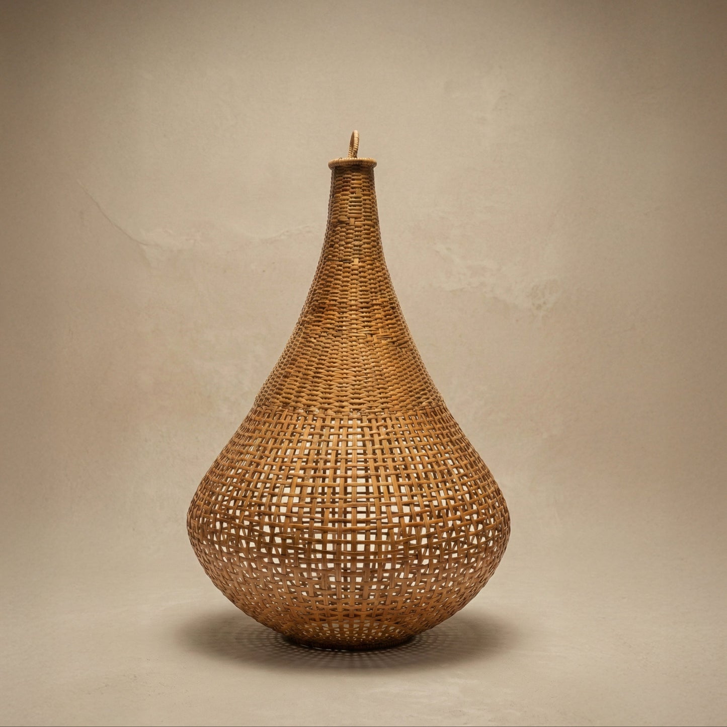 The Knup Ancestral Lampshade in teardrop form showing dense hand-woven bamboo lattice pattern, made by Khasi weavers in Meghalaya India, from WILLAGE