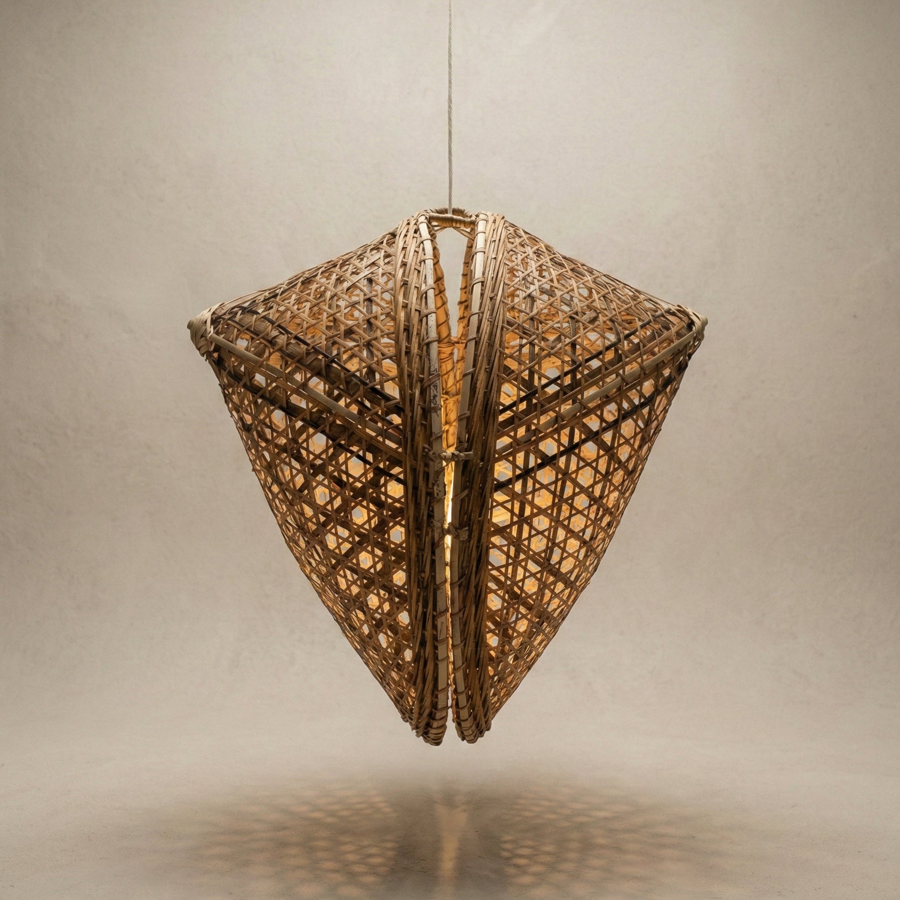 The Knup bamboo canopy lampshade shown for scale, 22 inches wide, with woven texture visible against a neutral background