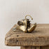 Brass anglerfish figurine with open jaw, needle teeth, and arcing lure, antique patina finish