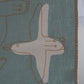 Detail of organic linen baby blanket showing hand-rendered figure and stitched edge, naturally dyed by Ewelina Lapeyre France