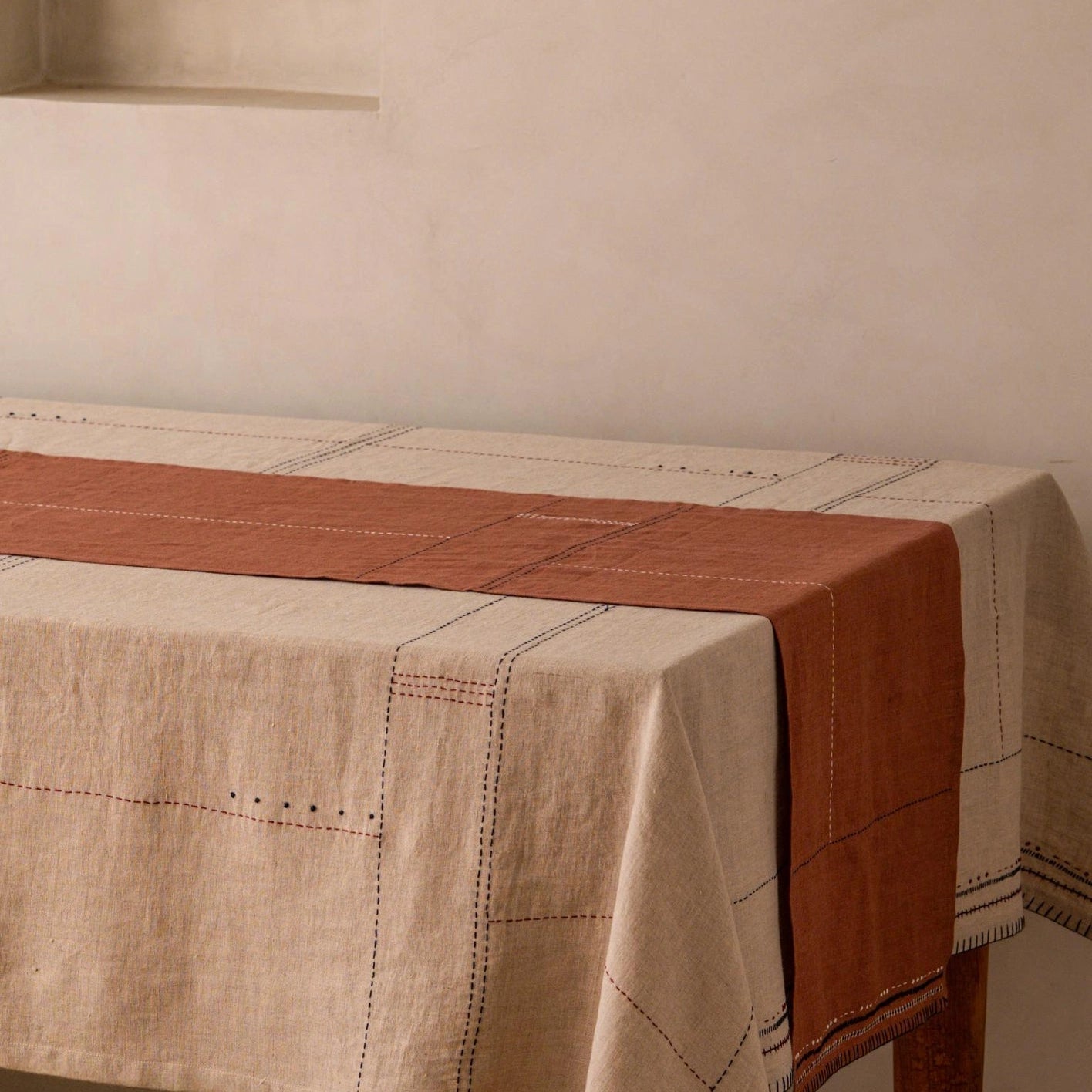 Macro detail of hand-stitched running stitch pattern on eucalyptus terracotta European linen table runner
Dismiss Shopify AI alt text suggestions.