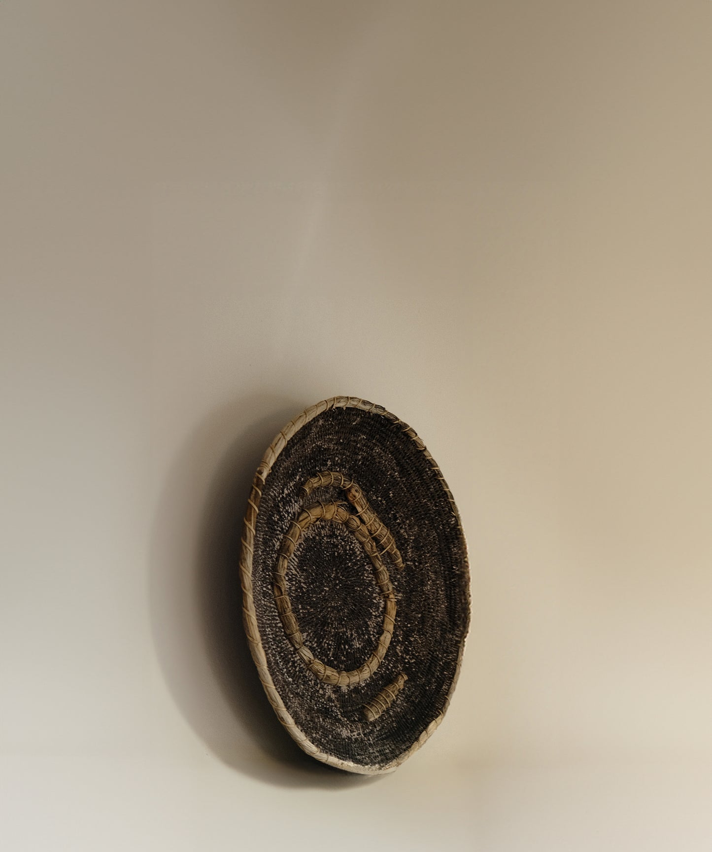 Vintage Makenge basket with concentric dyed pattern, handwoven from elephant grass by Mbunda women of Zambia