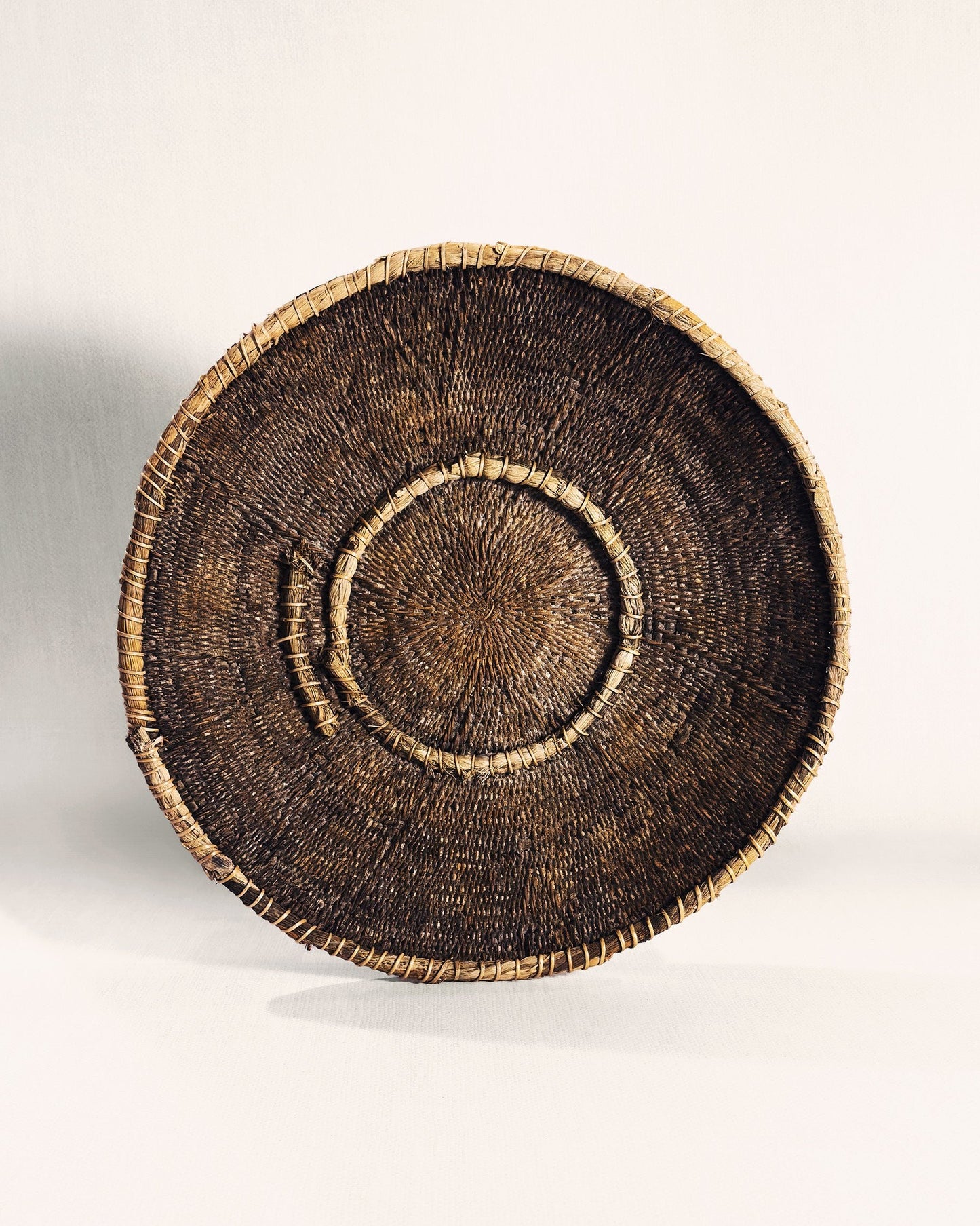 Vintage Zambian Makenge basket showing Makenge bush root dye pattern, traditional Mbunda craft