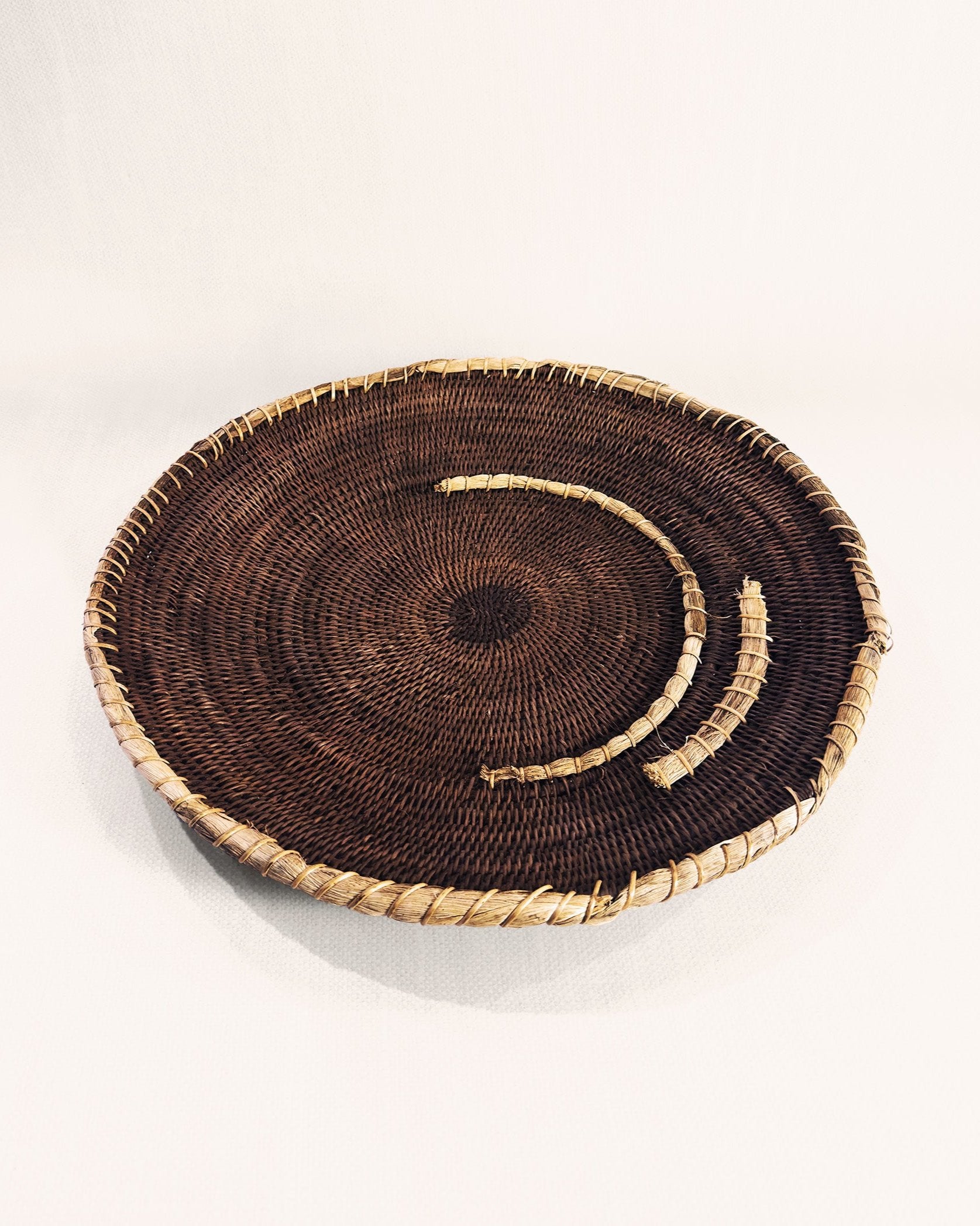 Vintage Zambian Makenge basket showing Makenge bush root dye pattern, traditional Mbunda craft