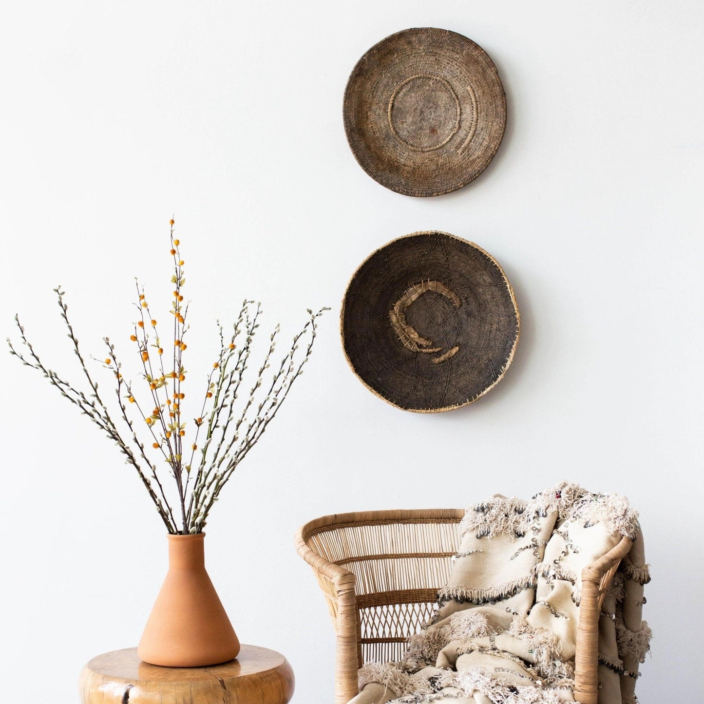 Vintage Zambian Makenge basket styled on console with dried pampas, natural fiber wall decor from WILLAGE