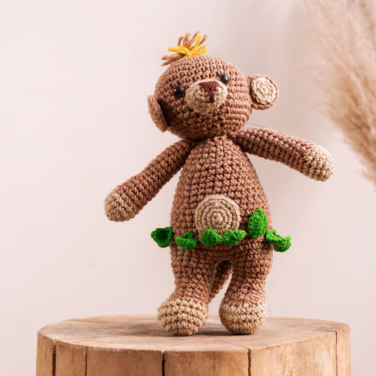 Hand-crocheted monkey amigurumi with crown detail, showing yarn finish and hand-stitched features, from The Hobbyt India