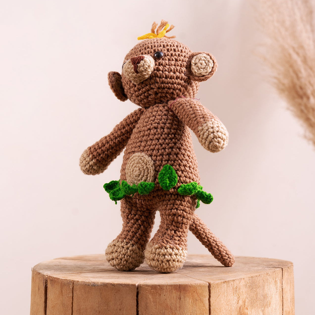 Milo the Mischievous Monkey hand-crocheted amigurumi with crown and leaf skirt, handcrafted by The Hobbyt in India, from WILLAGE