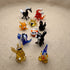 The Wild Ones set of 10 miniature lampworked glass figurines including black horse, red goldfish, orange fox, panda, blue dog, golden snail, black swan, and squirrel, by Glass by Iness