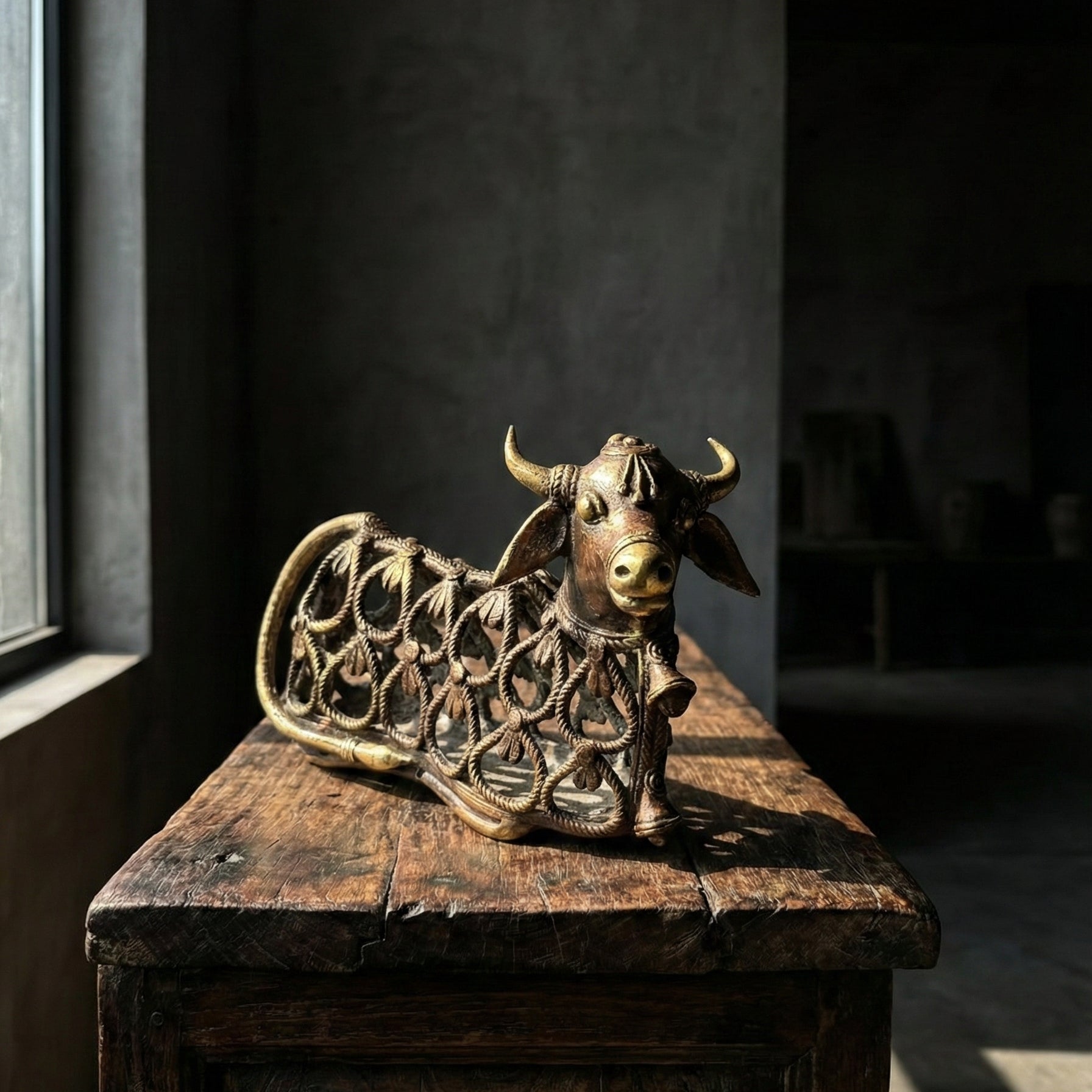 Nandi Keeper of Abundance Dhokra bull sculpture showing intricate lost-wax cast latticework and spiral surface detail, handcrafted in India, from WILLAGE