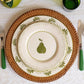 Four Olive Bloom dinner plates showing green floral pattern, hand-painted ceramic tableware from Portugal