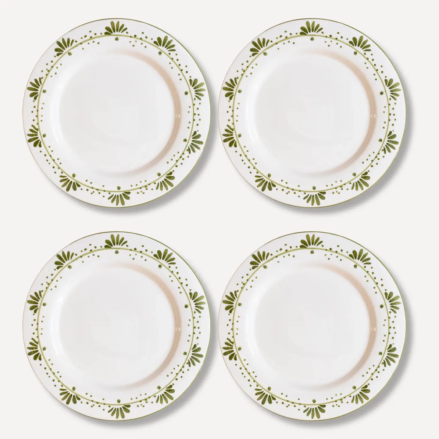 Four Olive Bloom dinner plates showing green floral pattern, hand-painted ceramic tableware 