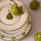 Hand-painted Portuguese dessert plate with pear motif styled with fresh pear, from Raquel Souza studio