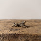 The Prowler miniature solid brass tiger figurine in a low prowling pose, finely striped with aged antique patina