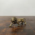 The Quiet Sovereign miniature brass lion figurine in mid-stride walking pose with detailed mane, solid brass with aged patina, from WILLAGE Tiny Objects collection